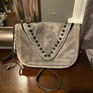 She+lo breakthrough leather studded crossbody bag.